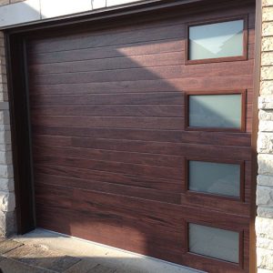 Modern Garage Doors-Fiberglass Modern Double Garage Doors with 4 lites During installation in Oakville-Ontario by modern-doors.ca