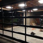 Oversized Aluminum Glass Clear Garage Door Installation in Custom Home in Oakville by Modern Doors