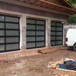 Modern Aluminum Garage Doors with Frosted Door Lites installed in a new modern home in Richmond Hill