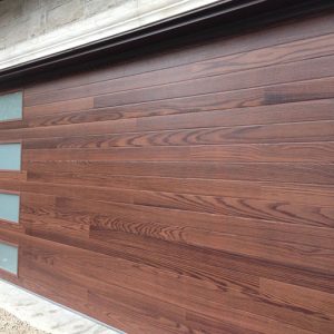 Modern Fiberglass Garage Doors-Fiberglass Woodgrain Modern Garage door with frosted door lites manufactured and installed by modern-doors