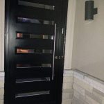 Modern Flush Glazed Fiberglass Doors with Clear Door lites and Stanless Steel Door Handle installed in Markham