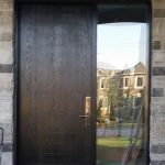 Modern Fiberglass Rustic Door with Multipoint Lock and frosted side lite installed in Brampton