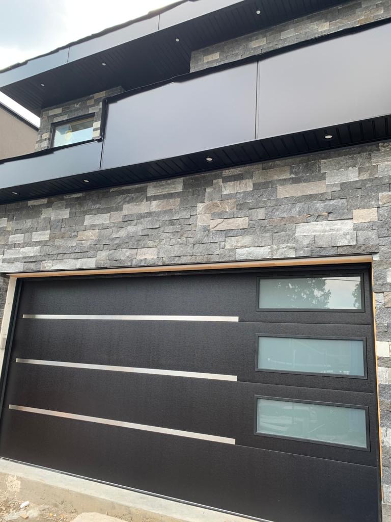 Modern Single Garage Door Stainless Steel Strips Glass Panels