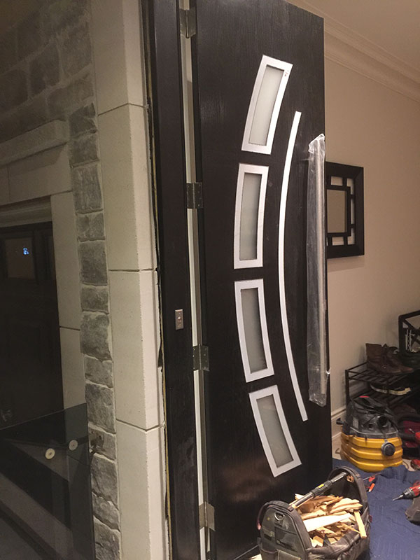 Custom Design Modern Doors-Arched Designed doors lites and stainless steel door handles dueing installation