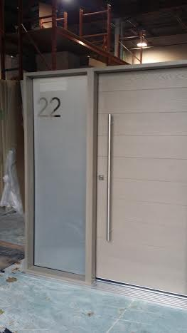 Fiberglass Door-Modern Rustic Door with Frosted Glass Side Lite & Stainless Steel Handle & Multi Point Locks During Manufacturing by modern-doors.ca