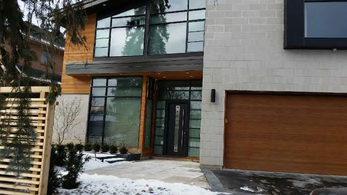 Fiberglass Modern Door with Stainless Steel Plate and Handle with small Door Lites and Multi Point Locks installed in Thornhill by Modern-doors.ca