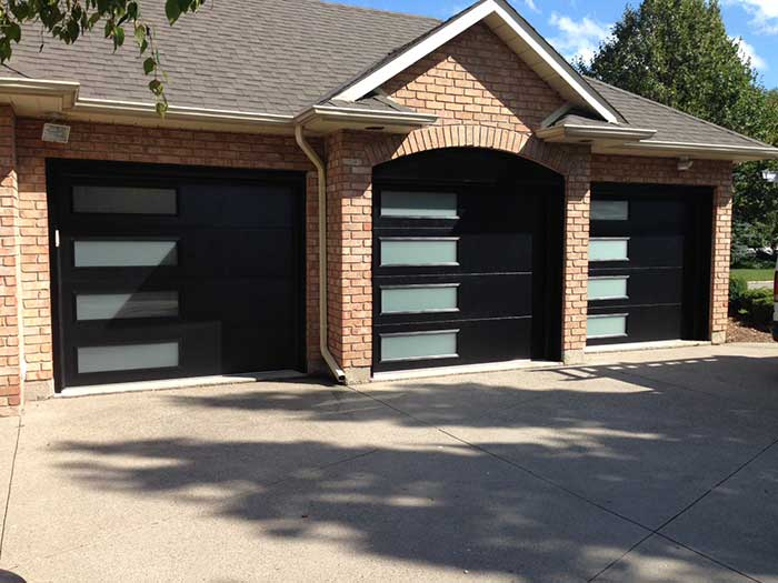 Modern Garage Doors with Frosted Side lites installed in Oakville by Modern Doors