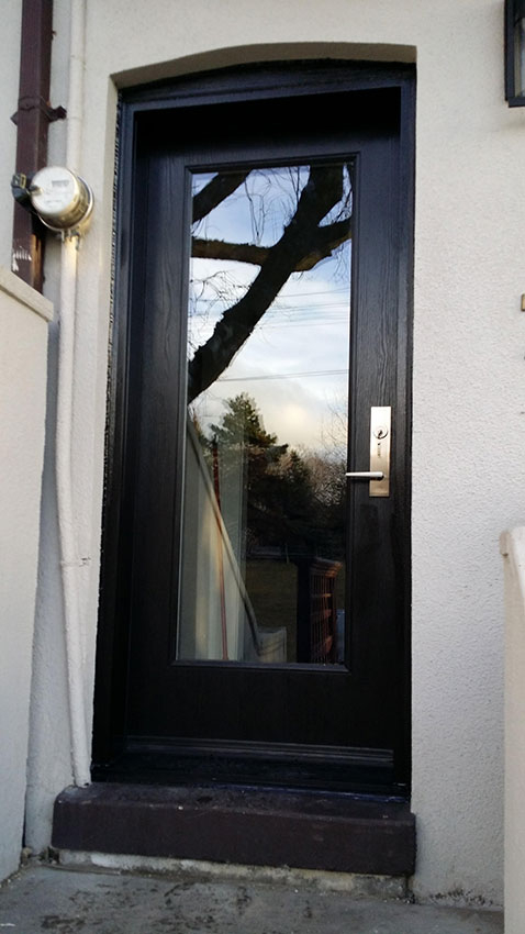 Modern Woodgrain Door with Clear Glass and Multi Point Locks installed in Richmond Hill